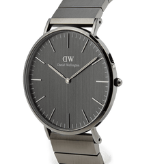 Classic Piano Link Graphite Unitone men's watch with a brushed graphite dial, slim stainless steel case, and a geometric piano link bracelet in a matte graphite finish.