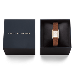 Daniel Wellington Bound Mini Light Brown Lizard Rose Gold watch presented in a black gift box, showing the slim rectangular case and brown lizard-textured leather strap alongside the branded box lid.