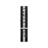 Black and white NATO strap by Daniel Wellington featuring Steven Harrington’s graphic eye-print design, crafted from durable polyester fabric with a silver clasp and adjustable fit.