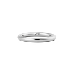 A slim, polished silver ring with a minimalist curved band and discreet inner logo, crafted from stainless steel and designed for versatile, everyday wear.