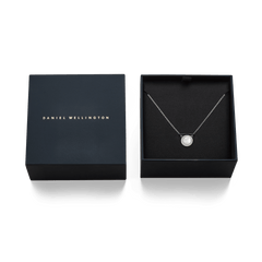 Audrey Necklace Mother of Pearl Silver displayed in an elegant Daniel Wellington gift box, highlighting the domed mother of pearl pendant with a halo of white cubic zirconia crystals on a polished silver chain.