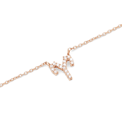 Rose gold chain necklace featuring a delicate zodiac pendant encrusted with sparkling crystals, designed for a refined and personalised look.