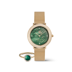 Gold mesh strap ladies watch with an emerald green dial and crystal-set bezel, paired with a matching gold ring featuring a malachite stone surrounded by pavé crystals.