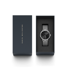 Classic Multi-Eye Sterling Onyx men's watch with a black dial and silver mesh strap, presented in a sleek Daniel Wellington gift box, ideal for gifting or special occasions.