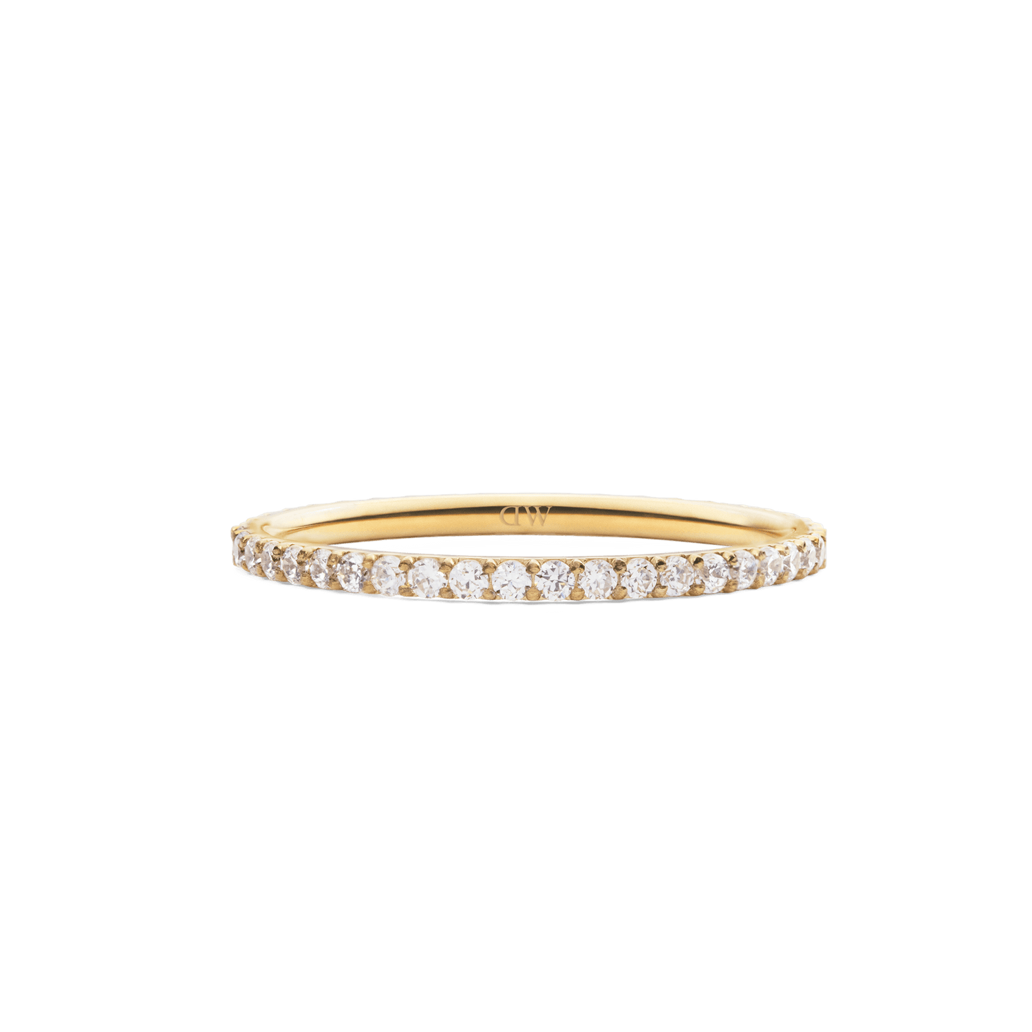 The Mirelle Eternity Ring Gold 1.4 mm features a slim gold band set with a continuous row of sparkling white cubic zirconia crystals, offering a refined and elegant look.