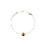Rose gold bracelet with a delicate chain, featuring a central tiger eye stone framed by a circle of white cubic zirconia and an adjustable clasp for a comfortable fit.