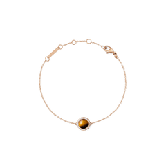 Rose gold bracelet with a delicate chain, featuring a central tiger eye stone framed by a circle of white cubic zirconia and an adjustable clasp for a comfortable fit.