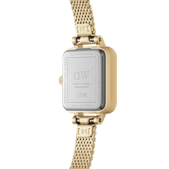 The back view of the Quadro Mini Evergold Amber highlights its stainless steel case, engraved details, and gold mesh strap, showcasing quality craftsmanship and Japanese movement.
