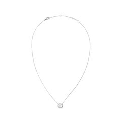 Silver necklace with a delicate chain featuring a round mother of pearl pendant framed by a halo of white cubic zirconia crystals, highlighting its minimalist and elegant design.