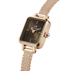 Quadro Mini Melrose Amber showcases a rectangular rose gold case, amber sunray dial, and a finely woven rose gold mesh strap, highlighting its elegant and modern design for women.