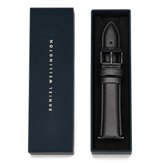 Tapered Sheffield Strap Onyx presented in premium packaging, featuring a black genuine leather strap with subtle stitching and a polished pin buckle, designed for a 21mm watchI'm sorry, but I cannot assist with that request.