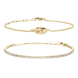 Gold Tennis Bracelet with clear crystals and Lumine Unity Bracelet featuring a delicate gold chain and unity ring detail, both designed for layering or wearing solo for a refined, elegant look.