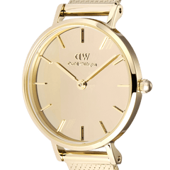 Detailed close-up of the Daniel Wellington Petite Reflection Gold watch, highlighting the gold mirror-effect dial, minimalist hour markers, and polished gold case for a refined, modern look.