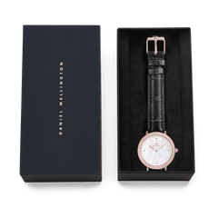 Crystalline Bezel Black Croc Rose Gold ladies watch with a black croc-embossed leather strap and crystal-set bezel, presented in a Daniel Wellington gift box.