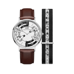 Limited edition Steven Harrington x Daniel Wellington watch set featuring a brown leather strap, silver case, and illustrated black and white dial, paired with an interchangeable black and white NATO strap with eye-print motif.