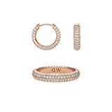 Rose gold jewellery set featuring a pavé crystal ring and matching hoop earrings, both with rows of sparkling stones that create an elegant and cohesive look.