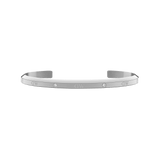 Slim silver cuff bracelet with a polished finish, featuring six sparkling crystals evenly spaced along the surface and an open design suitable for small wrists.