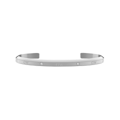 Slim silver cuff bracelet with a polished finish, featuring six sparkling crystals evenly spaced along the surface and an open design suitable for small wrists.