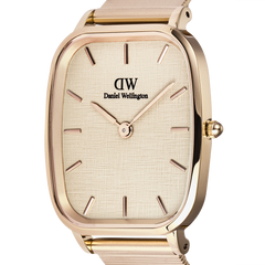 Close-up of the Marlon Wire Linen Rose Gold watch showing the linen-textured soft yellow dial, minimalist hour markers, and polished rectangular rose gold case.