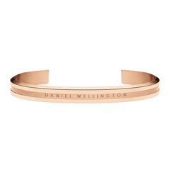 Rose gold Elan Bracelet with a sleek open cuff design, engraved Daniel Wellington logo, and polished finish, ideal for layering or everyday wear.