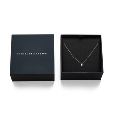 Mirelle Solitaire Necklace Silver presented in a sleek black Daniel Wellington gift box, highlighting the delicate silver chain and cubic zirconia pendant as a stylish gifting option.