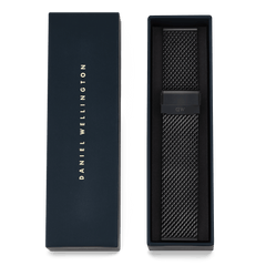 Onyx Mesh Strap in black stainless steel with a fine woven texture, presented in a Daniel Wellington gift box, ideal as a replacement mesh strap for classic or smartwatches.