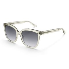 Grande Bio-Acetate Olive Olive sunglasses featuring a clear olive oversized square frame and black gradient UV400 lenses, shown at an angle to highlight the sleek, modern design and sustainable bio-acetate material.