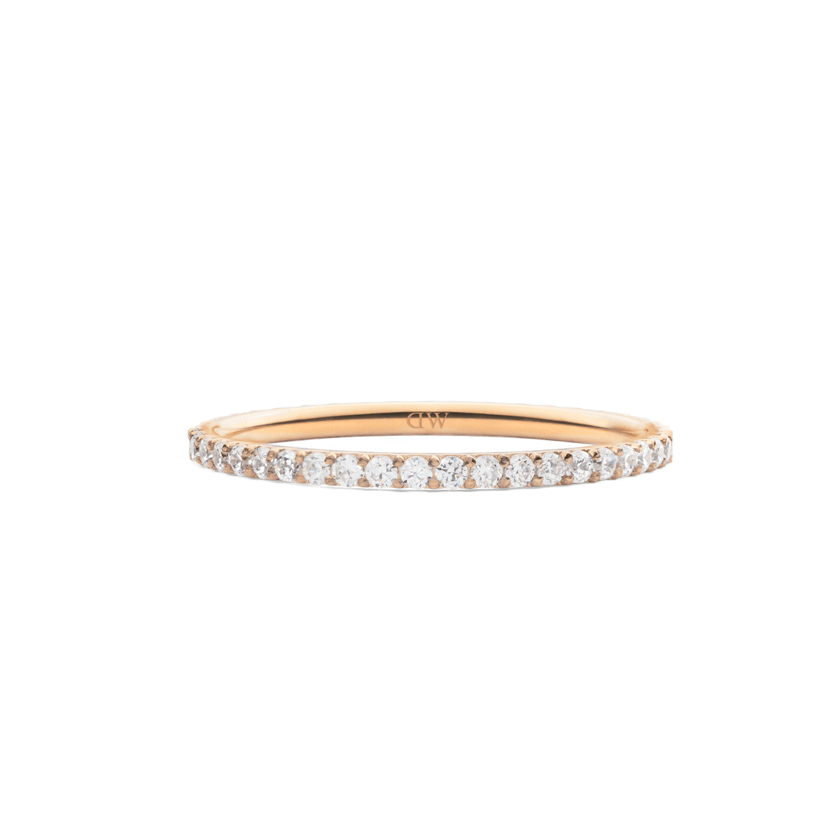 The Mirelle Eternity Ring Rose Gold 1.4 mm features a slim rose gold band set with a continuous row of sparkling white cubic zirconia crystals, offering a minimalist and elegant style.