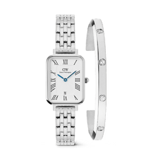 Rectangular silver ladies watch with a five-link stainless steel strap, Roman numeral dial, and blue hands, paired with a sleek silver cuff bracelet featuring sparkling crystal accents.