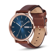 Classic Day Display St Mawes Rose Gold Arctic men's watch with a blue textured dial, rose gold case, day and date display, and brown genuine leather strap, shown at an angle to highlight its elegant design and craftsmanship.