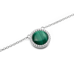 Close-up of the Audrey Necklace Malachite Silver pendant, featuring a domed green malachite stone surrounded by a halo of sparkling white cubic zirconia crystals on a fine silver chain.