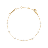 Slim gold chain bracelet featuring alternating white Swarovski glass pearls and cubic zirconia stones, with an adjustable clasp for a comfortable fit.