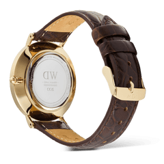 Back view of the Classic Roman Numerals Date Dark Brown Croc Belly Gold watch, highlighting the gold PVD-plated case, engraved case back, and dark brown crocodile-embossed leather strap with a gold pin buckle.