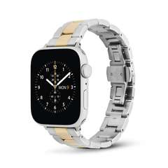 Apple Watch fitted with the Smartwatch Iconic Link two-tone strap, featuring polished gold centre links and brushed silver outer links in a classic 3-link design, crafted from stainless steel with a butterfly buckle closure.