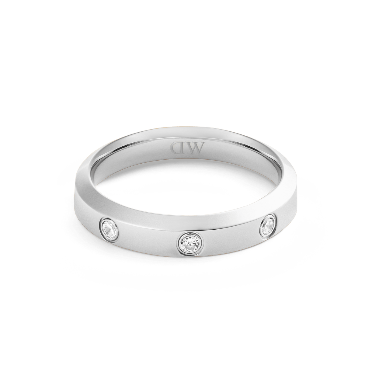 Classic Lumine Ring Silver 4 mm with a sleek, polished silver band and three cubic zirconia stones set into the surface, offering a minimalist and elegant design.