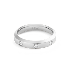 Classic Lumine Ring Silver 4 mm with a sleek, polished silver band and three cubic zirconia stones set into the surface, offering a minimalist and elegant design.