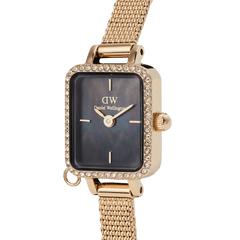 Close-up of the Daniel Wellington Quadro Mini Crystal Zodiac Evergold Set, highlighting the rectangular gold case with sparkling crystals, black mother of pearl dial, and the fine gold mesh strap.