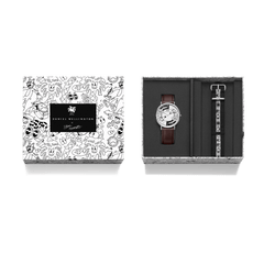 Steven Harrington x Daniel Wellington Bristol BW dial & Strap Silver set presented in exclusive illustrated packaging, featuring a brown leather strap watch and an interchangeable black and white NATO strap with eye-print motif.