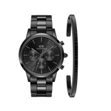 Sleek black chronograph watch with a polished steel link strap, paired with a minimalist black cuff bracelet featuring subtle engraved branding, both crafted from stainless steel for a refined and versatile men's accessory set.