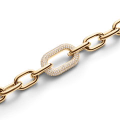 Gold chain-link bracelet with a pavé crystal accent link, featuring polished links and a modern, adjustable design suitable for stacking or everyday wear.