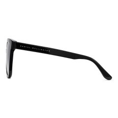 Side view of Grande Bio-Acetate Black Blue sunglasses showing the sleek black acetate frame and Daniel Wellington branding on the arm.