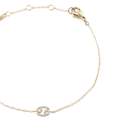 Gold chain bracelet with an adjustable clasp, featuring a Cancer zodiac charm set with sparkling crystals and a slim, elegant design.