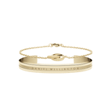 Elan Bracelet & Unity Gold set featuring a minimalist gold cuff with engraved branding and a delicate chain bracelet with interlocking rings, both in a polished gold tone.