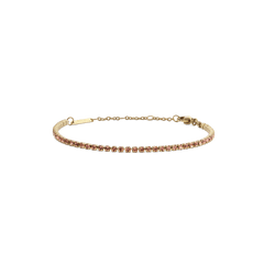 Slim gold tennis bracelet featuring a row of apricot-coloured crystals, adjustable with a lobster clasp and sizing rings for a secure, comfortable fit.