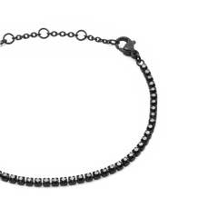 Close-up of the Black Crystal Tennis Bracelet showing the claw-set Preciosa black crystals, adjustable sizing rings, and secure lobster clasp on a sleek black stainless steel chain.