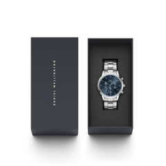 Iconic Chronograph Arctic S men's watch with a blue dial and silver stainless steel bracelet, presented in a Daniel Wellington gift box, ideal for graduations, anniversaries, or everyday milestones.